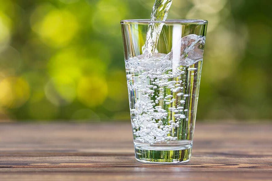 Image of a cup being filled with water. 