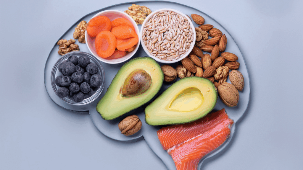 Healthy foods arranged in the shape of a brain to represent the link between nutrition and mental health.