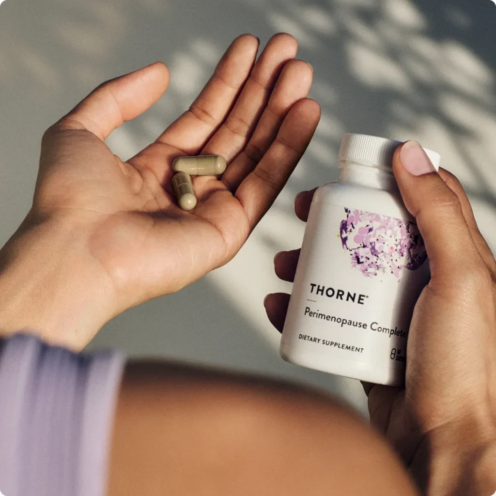 Woman holding perimenopause supplement